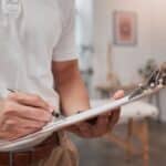 Physical therapy chiropractor and clipboard wellness data of spa massage consultant or chiropractor